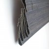 Bamboe vouwgordijn donkerbruin opgevouwen zijkant